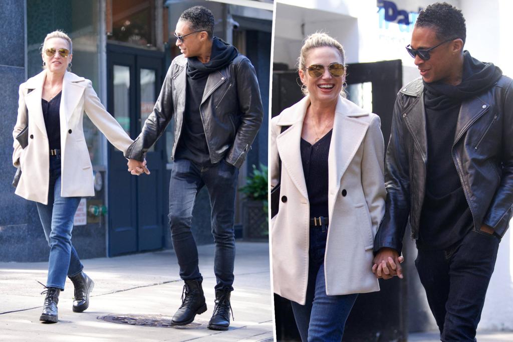 Amy Robach and T.J. Holmes hold hands as they leave her apartment in NYC