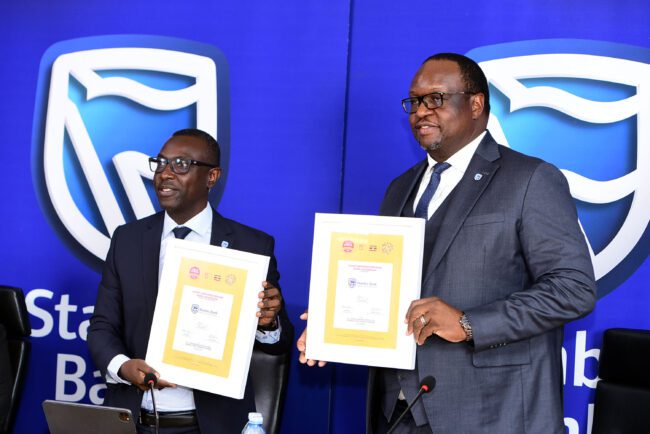 Ronald Makata Stanbic Bank Chief Finance Officer with the Mumba Kalifungwa, Stanbic Bank Uganda Chief Executive